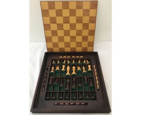 A vintage wooden chess/draughts set.Contained in a wooden case with compartments for pieces.  All pieces present.