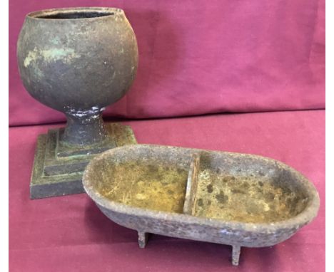 A vintage cast iron urn on stepped base together with a vintage cast iron animal/bird drinker/trough