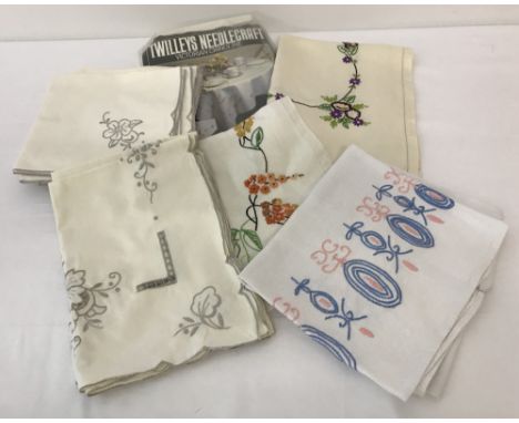 A small collection of vintage linen items.To include hand embroidered and cutwork napkins (12) and tray cloths. Together with