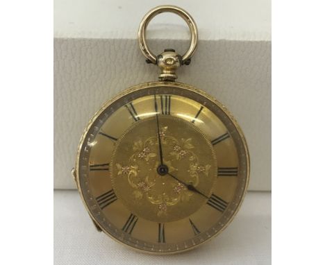 An 18ct yellow gold cased fully engraved, key wound, open face ladies pocket watch. Fully engraved reverse with empty shield 