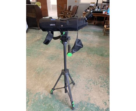 An Opticron spotting scope on tripod stand