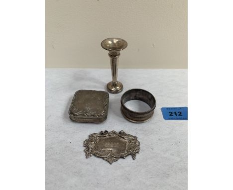 A silver snuffbox (A.F.); a silver gin label; a silver napkin ring and a silver loaded bud vase. 1oz 17dwts weighable (4)