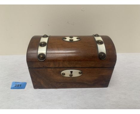A Victorian walnut tea caddy with domed lid. 8' wide