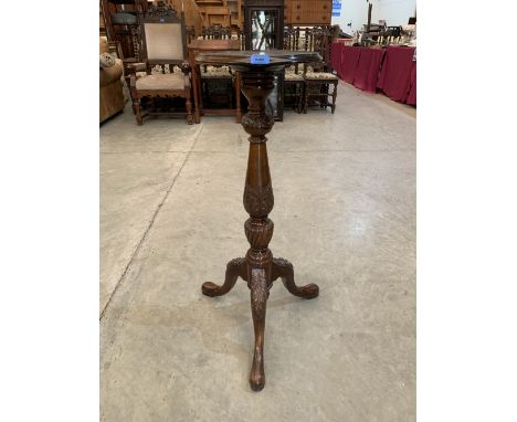 A Victorian mahogany torchere on tripod cabriole support. 36' high