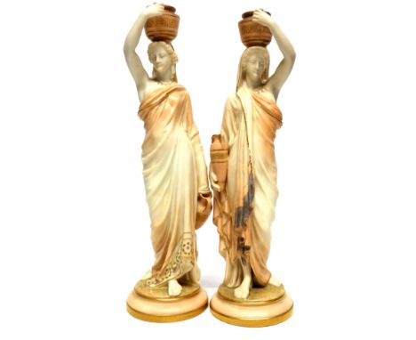 Pair of Royal Worcester water carrier figures after James Hadley, modelled as classical ladies on circular bases (2), 25cm hi