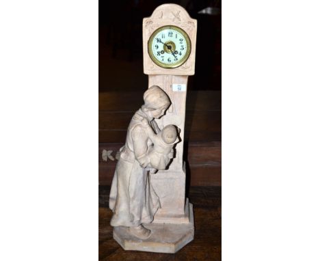 Large Dutch model of a lady and child against a model of a clock, modelled in plaster, with clock inset with French movement,