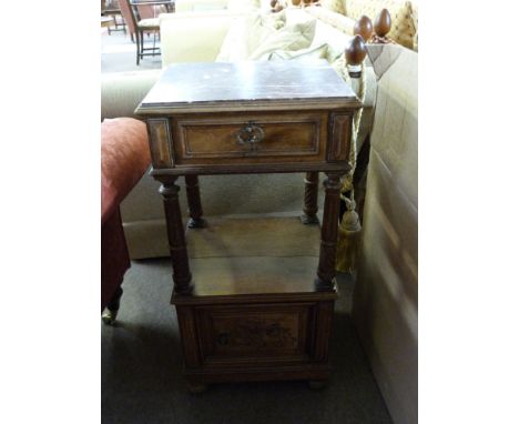 Late Victorian walnut bedside stand with inset veined marble top above a single drawer, open section to centre with four flut