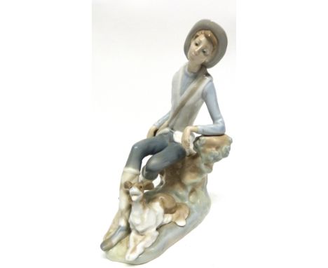 Lladro figure of a young boy with hound by his feet