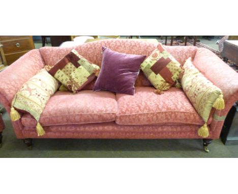 Mark Elliot contemporary pink/burgundy fabric covered three-seater sofa with serpentine back, complete with two fitted cushio