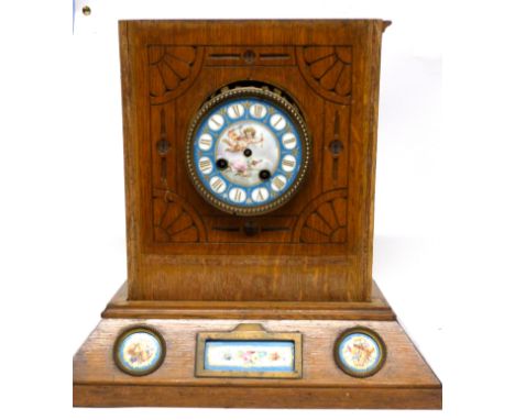 Sevres style clock with dial and inset into a light oak wooden frame, etched with an Art Nouveau design, 31cm high (a/f)