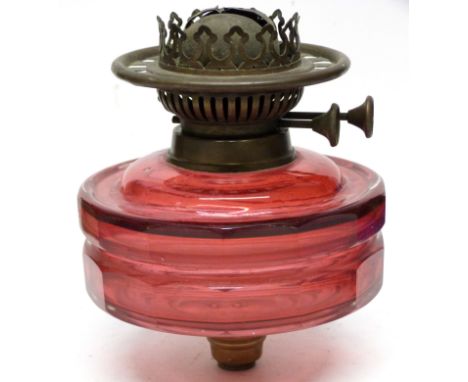 19th century glass lamp font in pink glass of faceted shape with attached burner