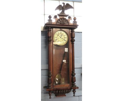 Mahogany cased Vienna type wall clock with eagle crest brass mounted Roman chapter ring within subsidiary dial and inscribed 