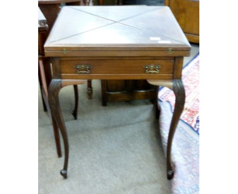 Late Victorian mahogany envelope card table, the four section top opening to reveal a green baized interior with coin reservo