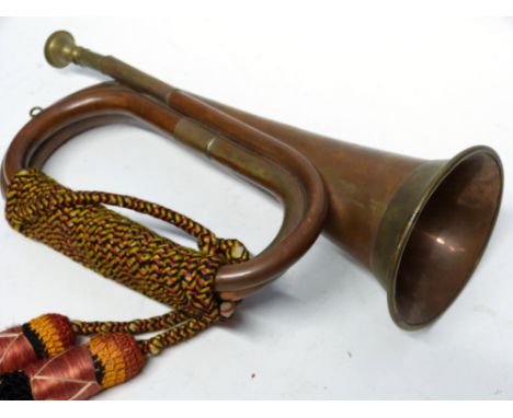 Copper military bugle with brass inlay and sash, 30cm long