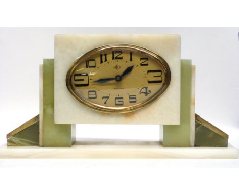 Art Deco mantel clock in stepped onyx base, the clock with gilt oval case, made by DEP, French made, with Deco style numerals
