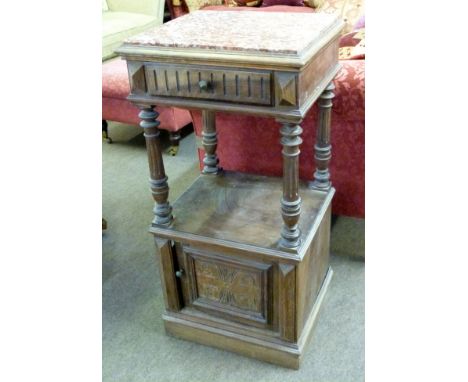 Late Victorian walnut bedside stand with rouge marble inset top above a drawer and door, open section under with four fluted 