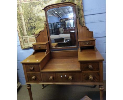 Large mid/late 19th century Continental mahogany dressing table, the superstructure with central arched swing mirror flanked 