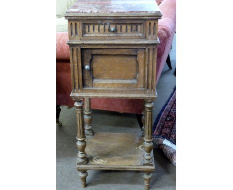 Late Victorian walnut bedside stand with rouge marble inset top above a drawer and door, open section under with four fluted 