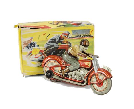 A Technofix Tinplate Clockwork Motorcyclist G.E.258, red motorcycle with cream detailing, silver handlebars, tan rider with b