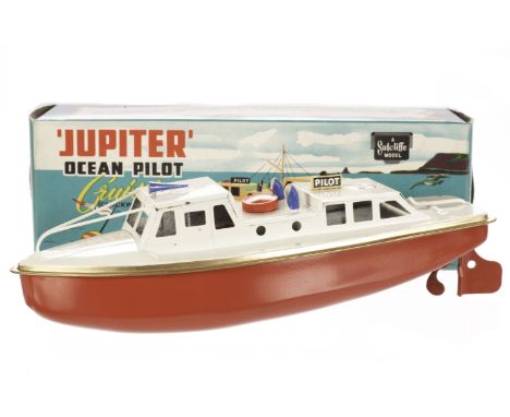 A Sutcliffe Model Jupiter Ocean Pilot Cruiser, tinplate clockwork model with red hull, white deck and gold trim, in original 