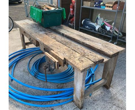 Large wooden work bench with vice