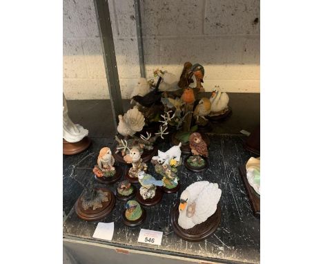 Quantity of hand painted ceramic animals on wooden bases