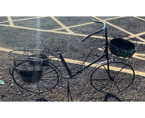 An iron bicycle planter