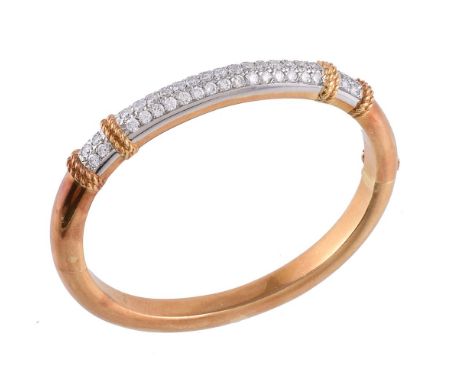 A French diamond bangle, attributed to Fred Paris, the hinged bangle partly pavé set with brilliant cut diamonds, approximate
