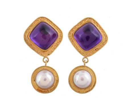 A pair of amethyst and mabé pearl earrings by Natalia Josca, the 11mm mabé pearls within a beaded surround suspended below a 