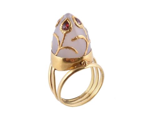 A Mughal white jade and garnet ring by Natalia Josca, the domed Mughal white jade with applied garnet set foliate detail, on 
