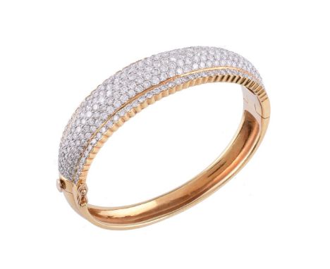 A diamond bangle, the hinged bangle pavé set with brilliant cut diamonds, approximately 8.00 carats total, stamped 18K 750, n