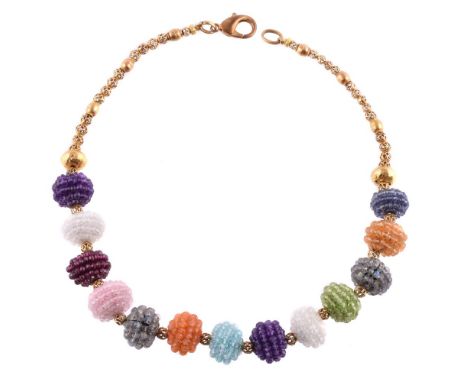 A multi gem set bead necklace by Natalia Josca, composed of gem set cluster balls, including amethyst, labradorite, garnet, p