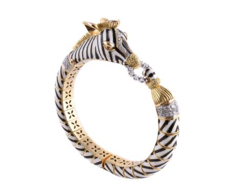An enamel and diamond zebra bangle, the zebra head in black and white striped enamel, set with brilliant cut diamonds, with a
