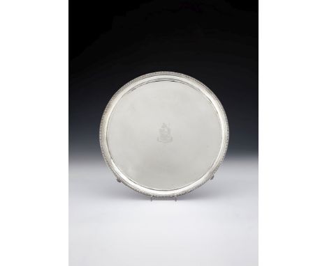 A George III silver circular salver by William Turton, London 1786 (incuse duty mark), with a beaded rim and incuve baseline,