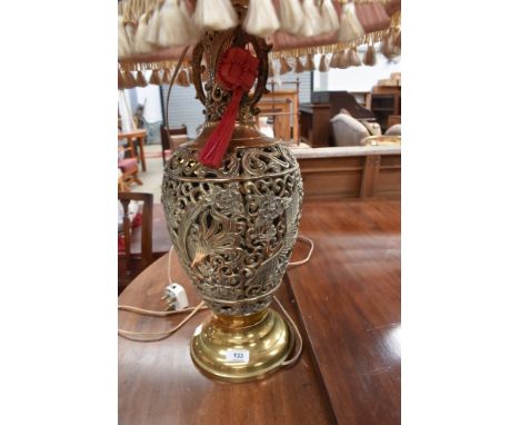 A vintage brass urn shaped table lamp, pierced phoenix decoration