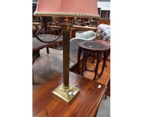 A brass table lamp having Corinthian style column