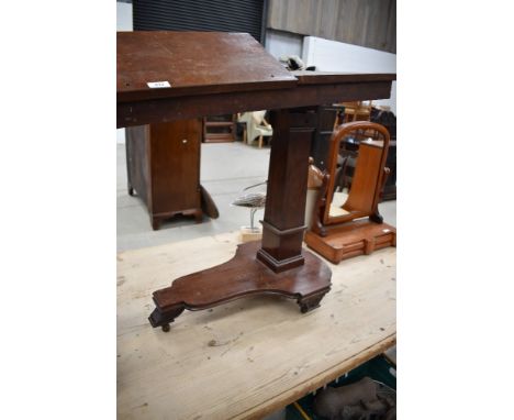 A Victorian mahogany rise and fall, adjustable music stand with two hinged platforms over the square section rise and fall ac