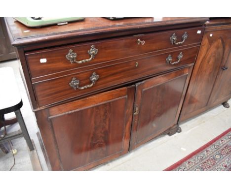 A 19th Century mahogany secretaire chest having crossbanded decoration to top, dummy double drawer and double cupboard under 