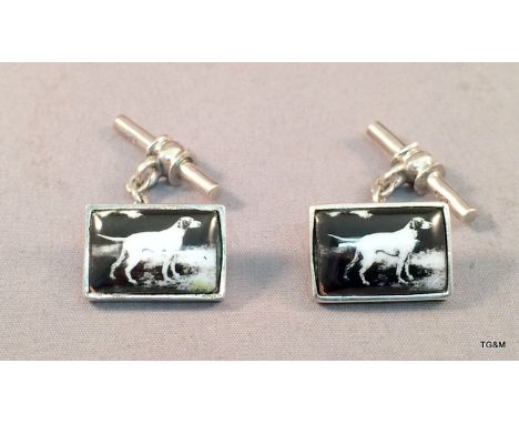 A pair of silver and enamel set cufflinks depicting retriever dogs