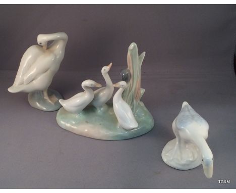 A Lladro swan with Goose and Ducks