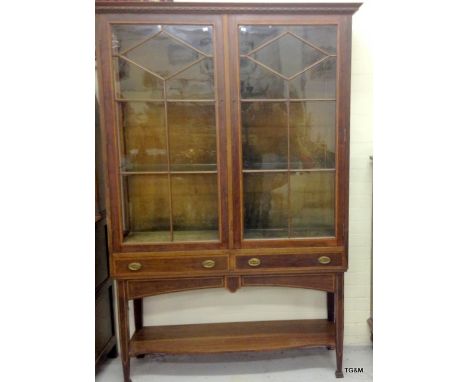 A mahogany inlaid display cabinet with 2 drawer and lower shelf standing on pad feet 190 x 120 x 40