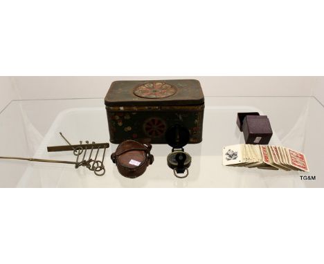 A collection of vintage storage tins from th e 1930's containing vintage cards and a USA military compass in case