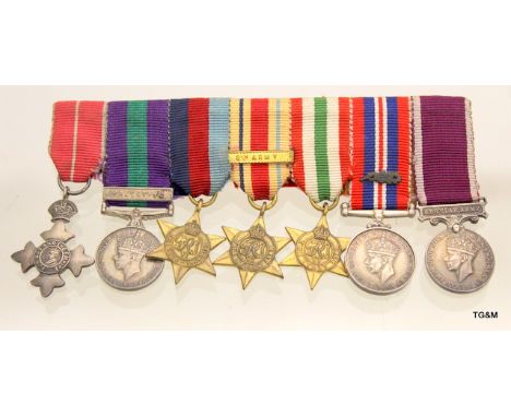 A WW2 mounted medal group of dress miniature medals including the OBE - GSM with Palestine clasp - Africa Star with 8th Army 