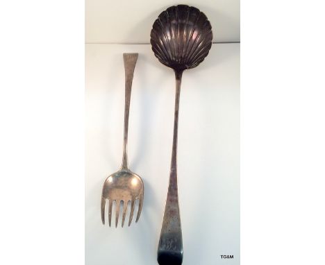 A Georgian silver serving fork and shell bowl ladle