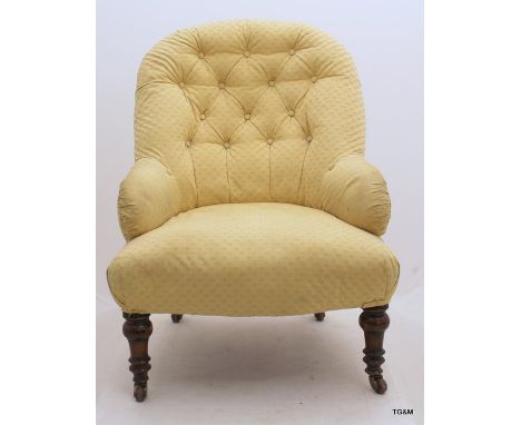 A Victorian button back nursing chair on turned supports 86cm 