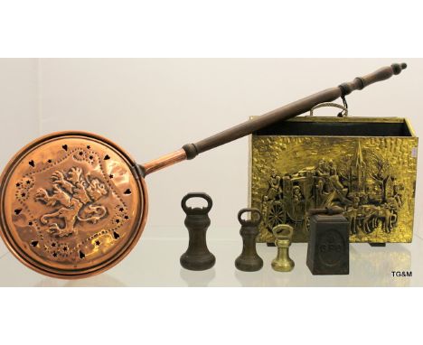 A large copper bed warming pan, 5 vintage scale weights and a brass magazine rack