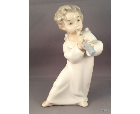A Lladro cherub with flute