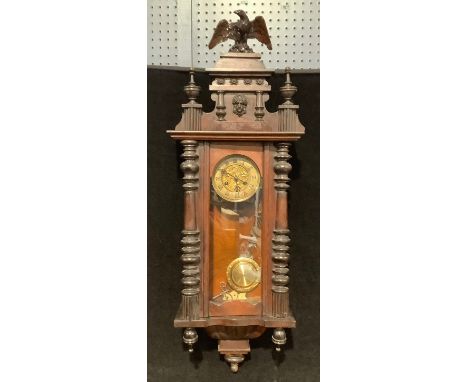 A late 19th century Vienna wall clock, gilt metal Art Nouveau dial, eagle crest, 110cm high 