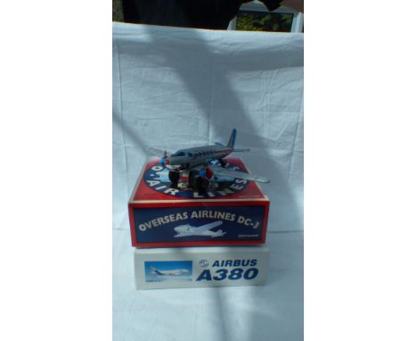 Aircraft - An official 1:400 scale Airbus 380 kit, boxed and unmade, together with a friaction drive tin plate Douglas DC3 by