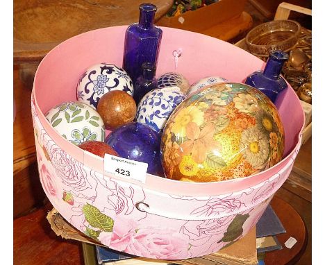 Ceramic carpet bowls, old cricket ball, Bristol blue glass poison bottles, etc.